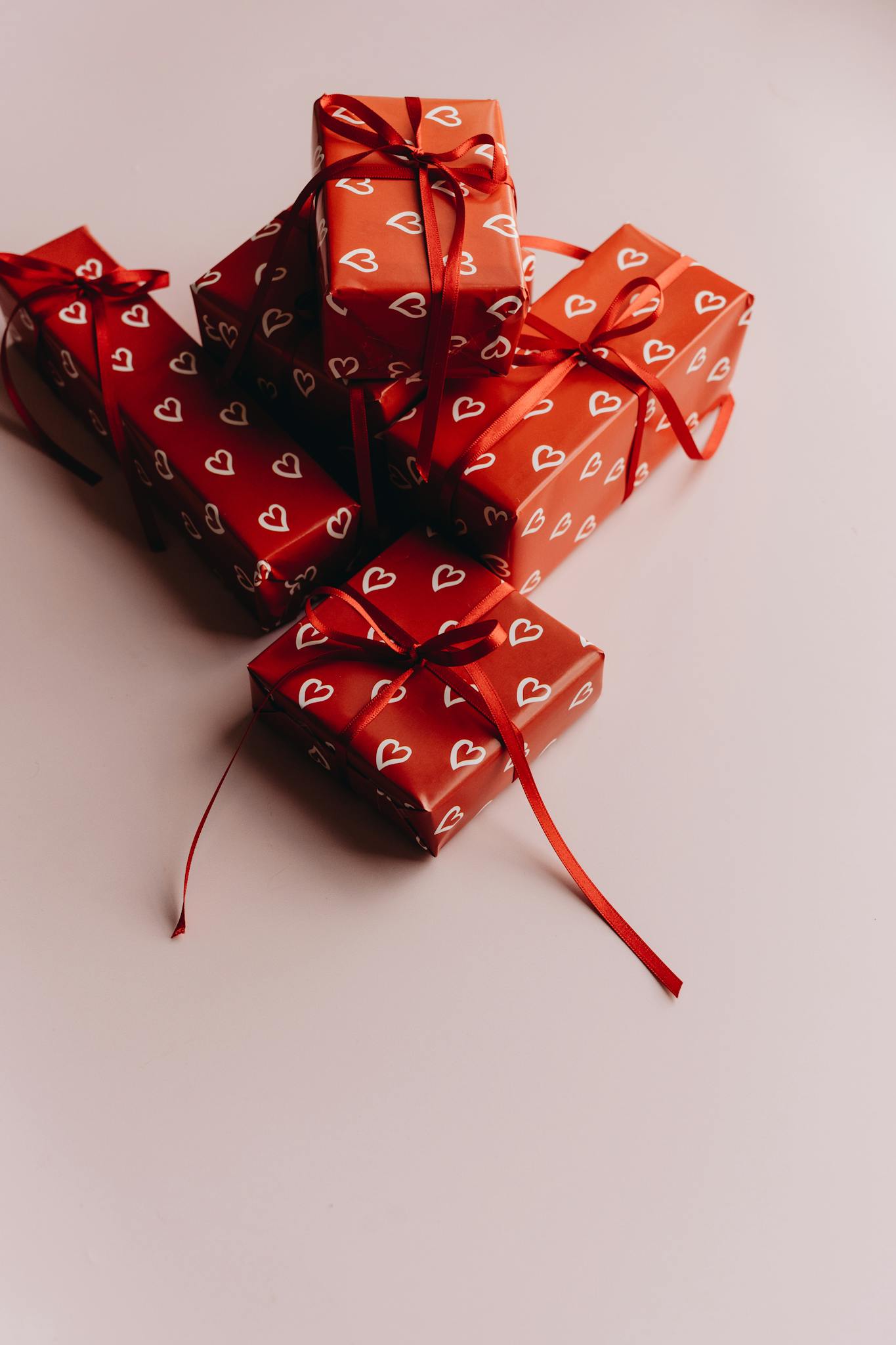 Festive red gifts with heart designs and ribbons perfect for special occasions.